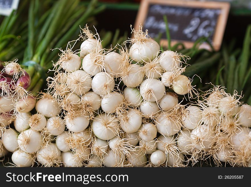 Spring onions on a market stall