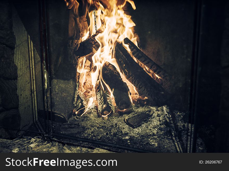 Burning fireplace at retro chimney