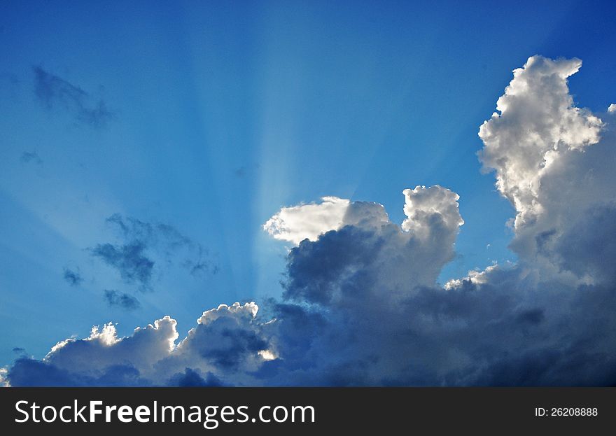 Sun breaks behind the clouds after a thunder storm. Sun breaks behind the clouds after a thunder storm