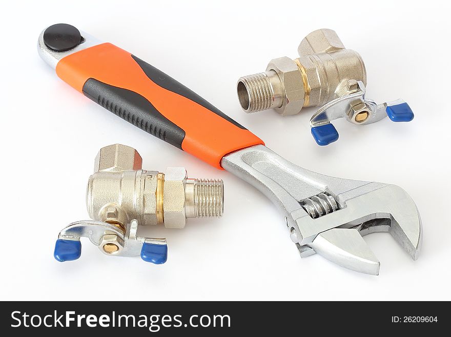 Wrench and two radiator crane over white background