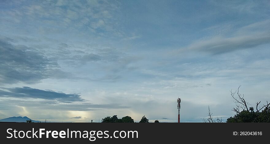 Building City And Green Natural Scenery With Beautiful And Cool Clouds That Are Pleasing To The Eye