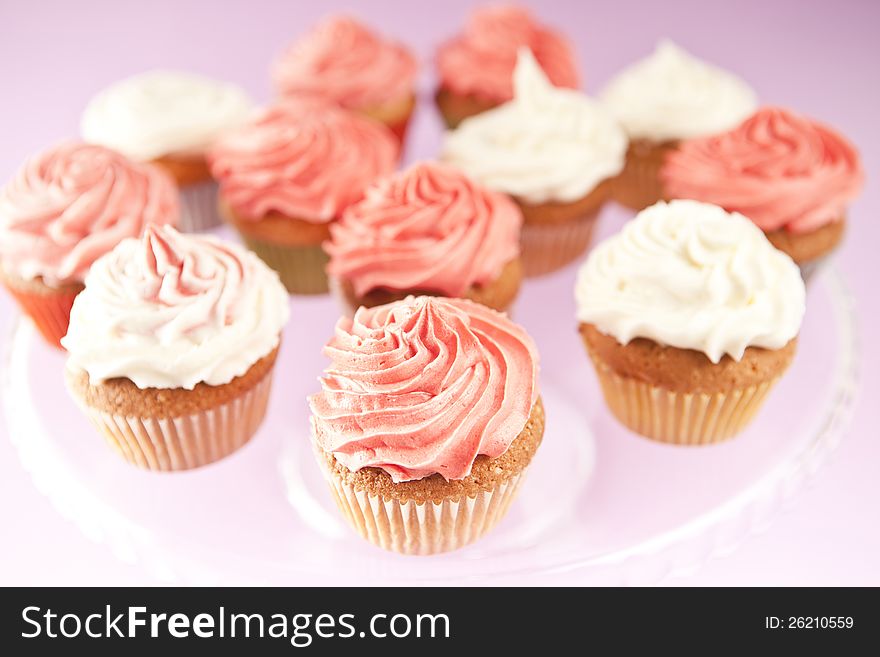 Homemade pink and white cupcakes on the plate