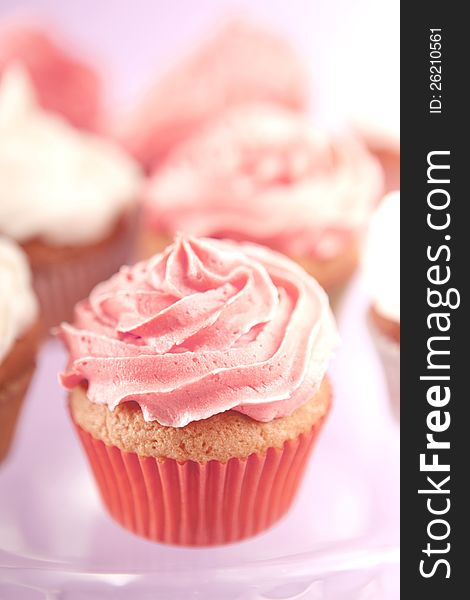 Homemade pink and white cupcakes on the plate