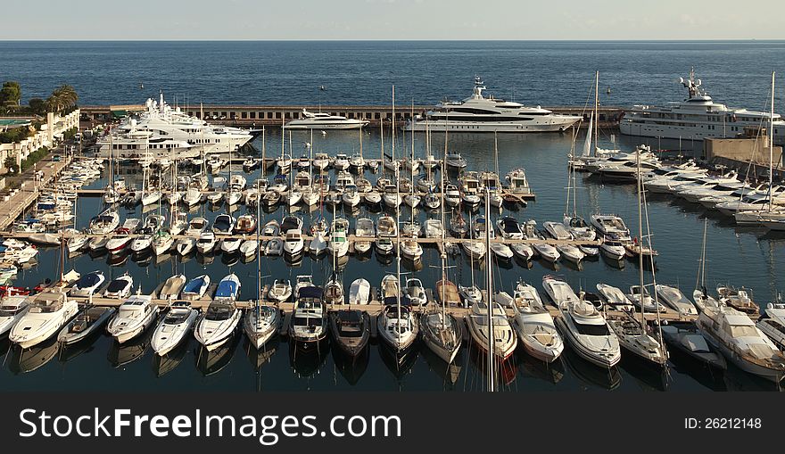 Harbor with yachts and the Mediterranean Sea in the background