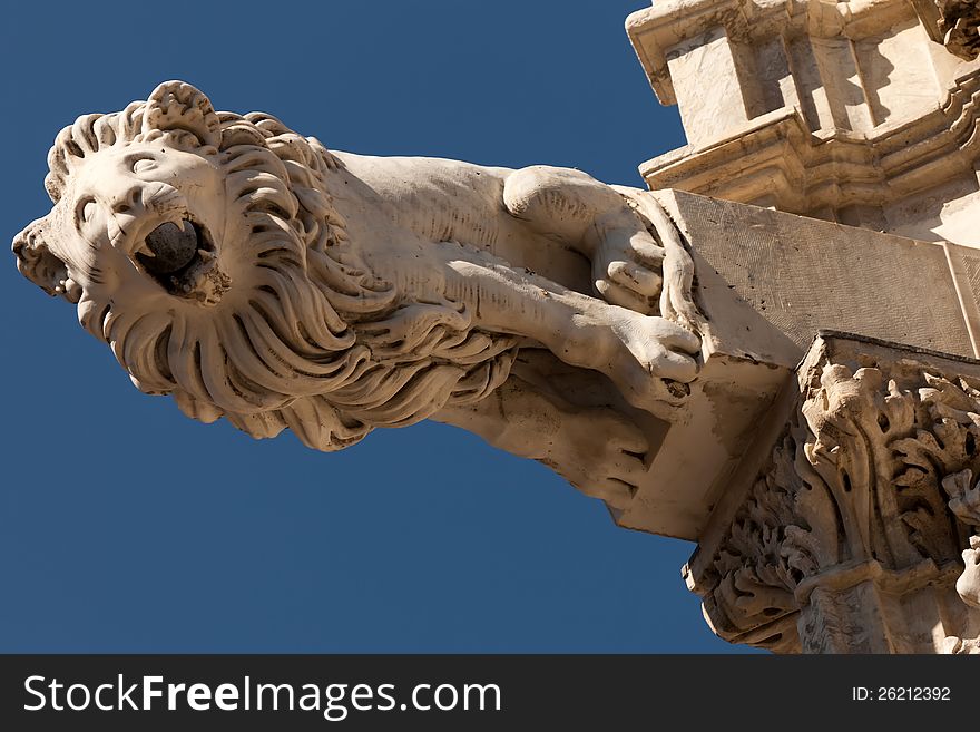 Gargoyle on the facade of the Siena Cathedral