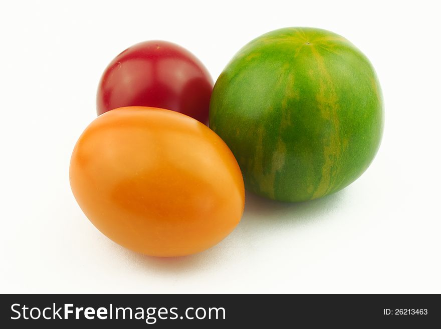 Tomatoes of various shape and color on white background. Tomatoes of various shape and color on white background