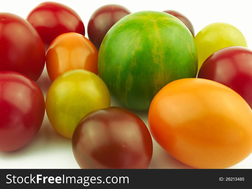 Tomatoes of various shape and color on white background. Tomatoes of various shape and color on white background