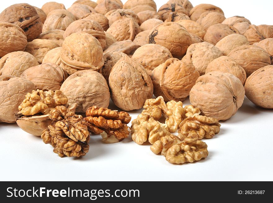 Brown walnuts on white background
