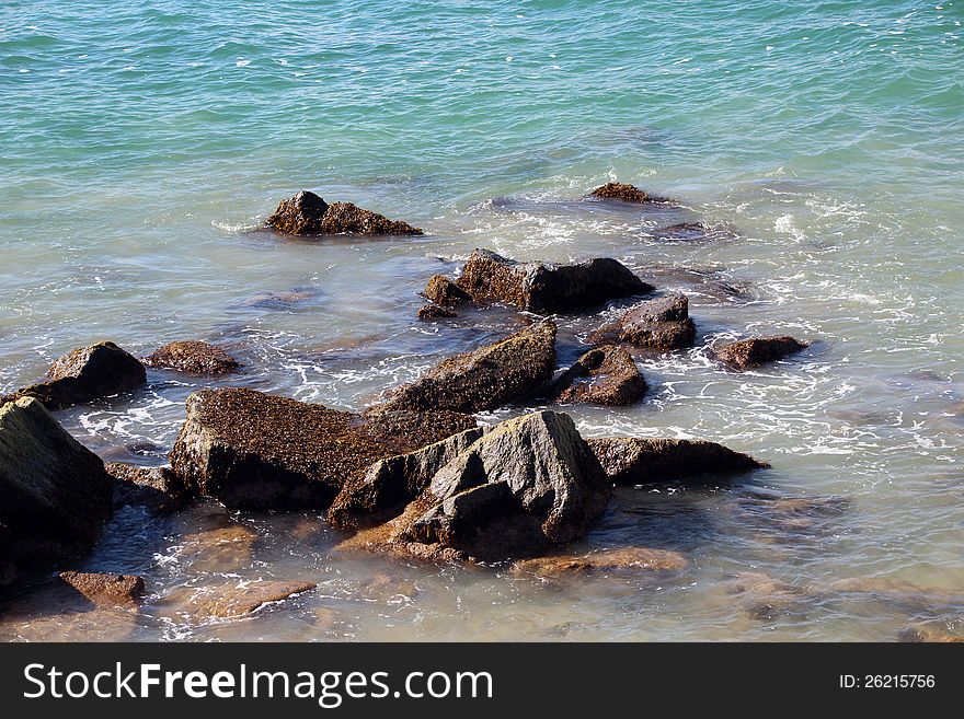 The tidal flow of the Indian Ocean  washes over the rocks near the fishing  groyne at Bunbury south western Australia. The tidal flow of the Indian Ocean  washes over the rocks near the fishing  groyne at Bunbury south western Australia.