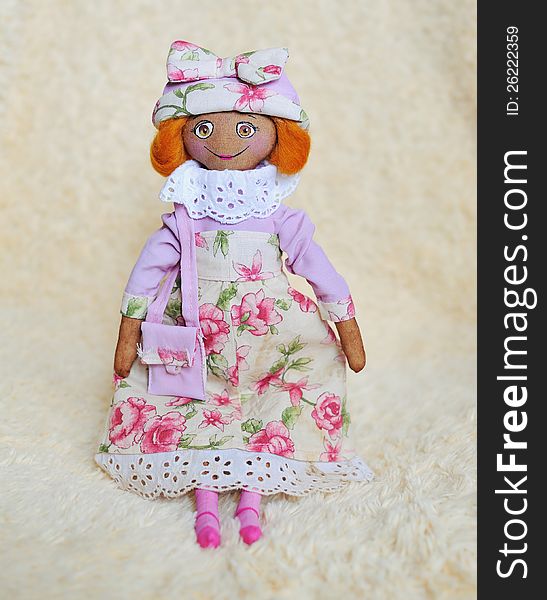 Handwork - a doll in a pink dress and a hat with a bag. Handwork - a doll in a pink dress and a hat with a bag