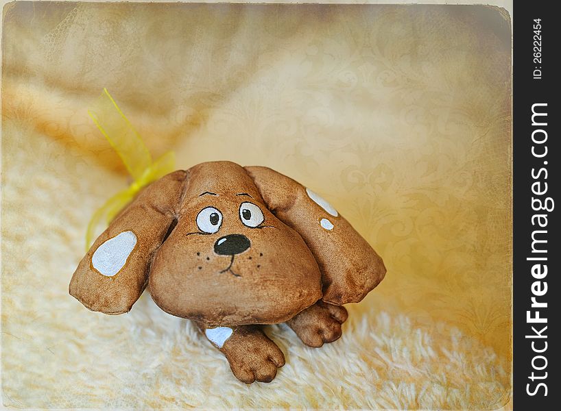 The head of a dog with big ears - a handwork toy. The head of a dog with big ears - a handwork toy
