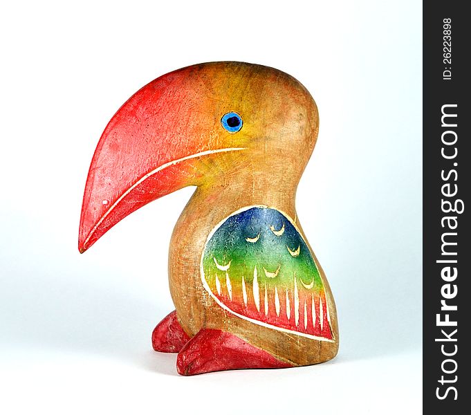 Colorful bird wood toy on white background