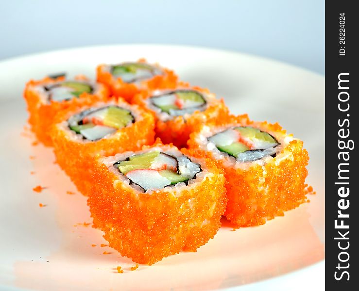 California maki, Japanese traditional food. sticky japanese rice roll with seaweed, sweet eggs cucumber and tobiko