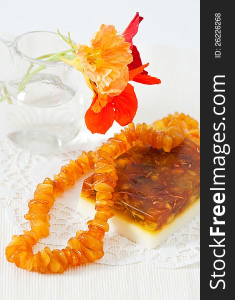 Handmade soap, amber beads and flowers nasturtium