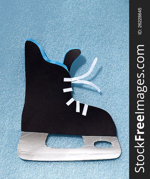Black skating shoe on blue backround. Black skating shoe on blue backround