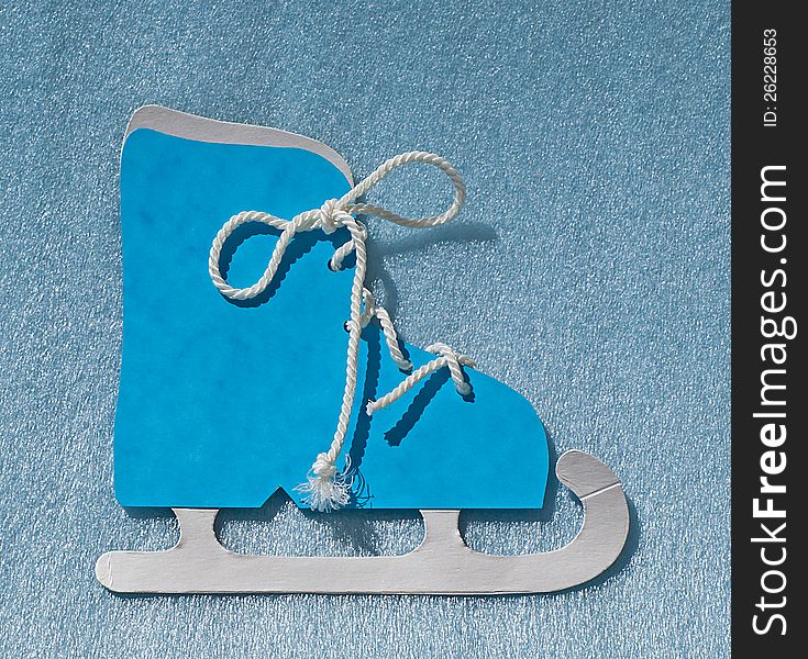 Blue skating shoe on a blue background. Blue skating shoe on a blue background