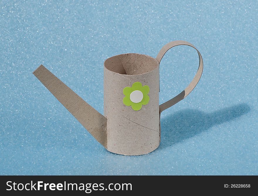 jug of paper tube with green flower