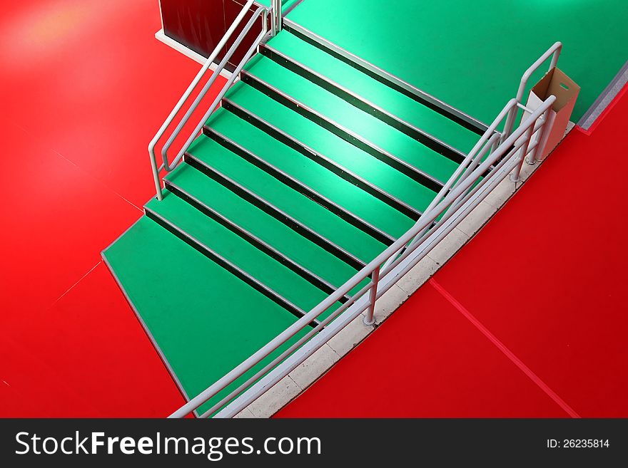 Green stairway and red carpet from above