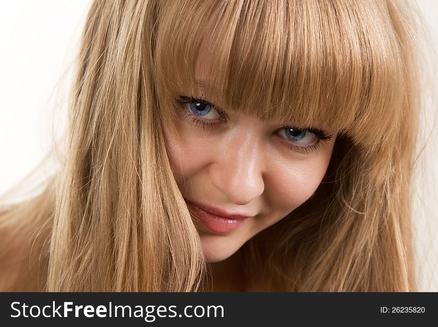 Face of the girl with blue eyes close up