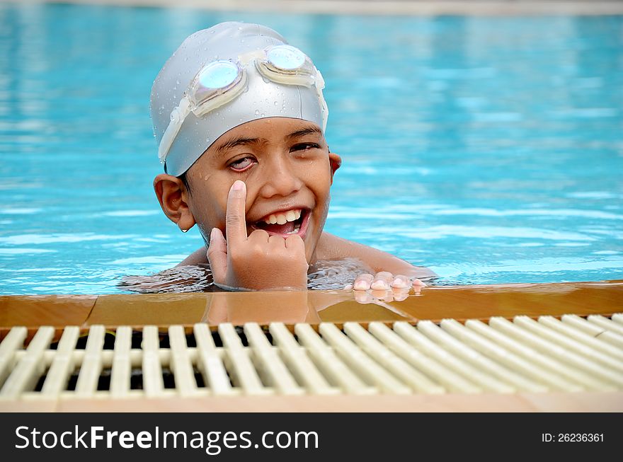 A boy with smiling face and swimming suit. A boy with smiling face and swimming suit.