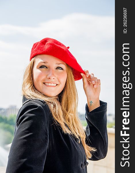 A Beautiful girl, wearing a red hat and smiling. A Beautiful girl, wearing a red hat and smiling.