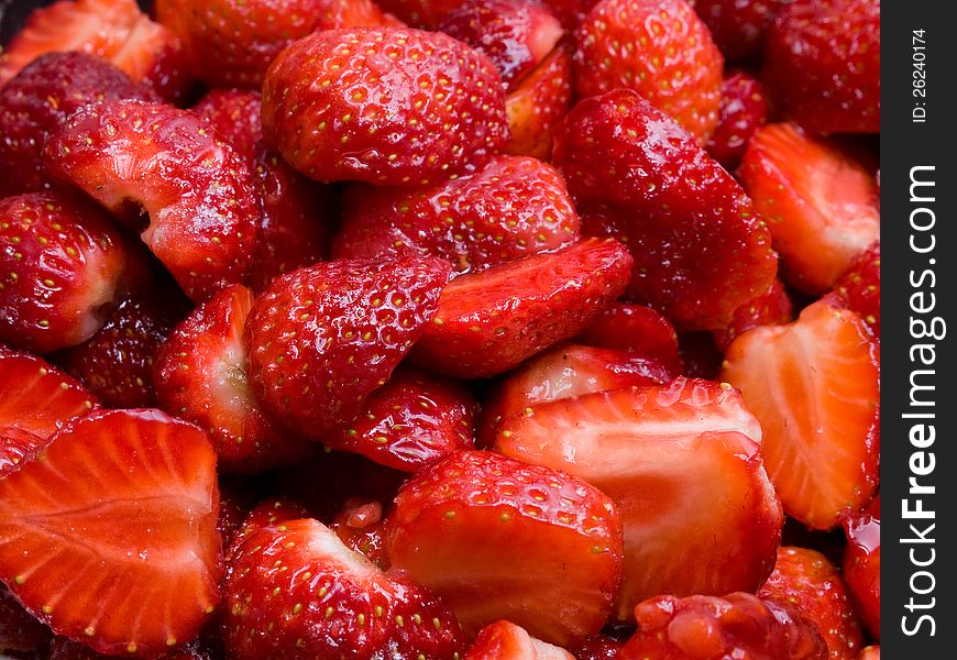 Fresh, sweet, red strawberries cut in halves, ready to be eaten. Fresh, sweet, red strawberries cut in halves, ready to be eaten.
