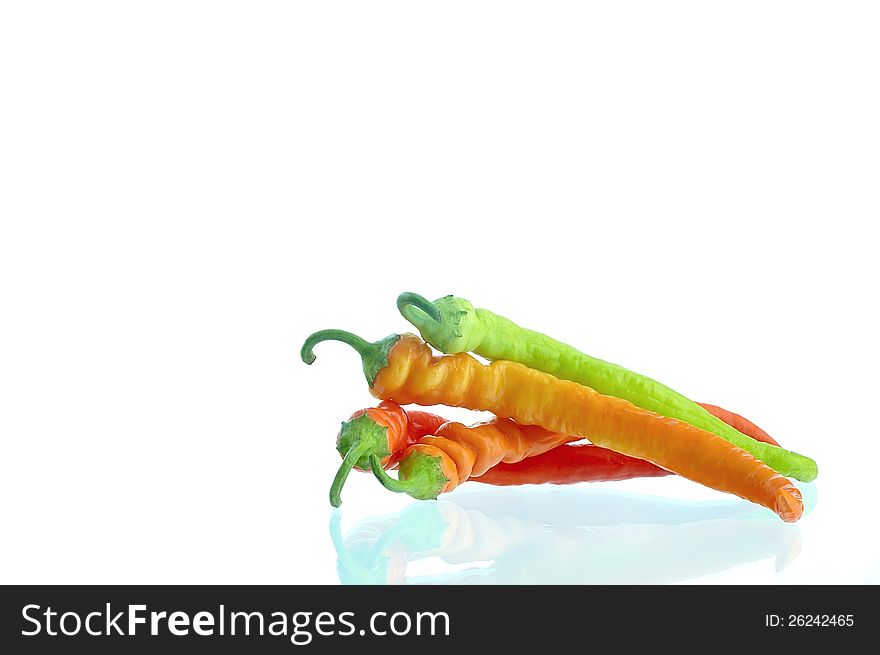 Hot pepper lying on a white background