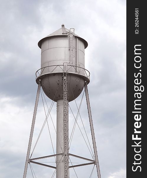 Old fashioned gray metal water tower