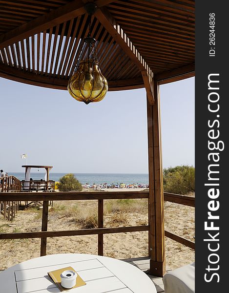 Wooden gazebo at beach with view over the sea, Algarve, Portugal. Wooden gazebo at beach with view over the sea, Algarve, Portugal.