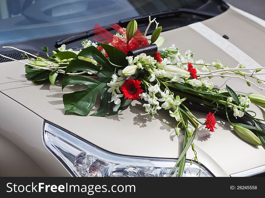 Flower bouquet on a car in celebration of wedding festivities
