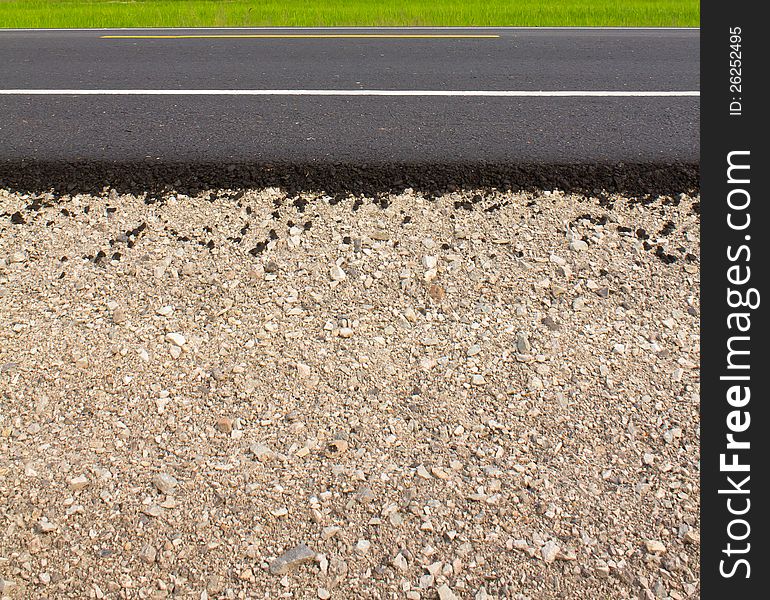 Rock and soil materials in the new asphalt.