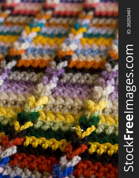 Details of the stitching and colours of a crocheted rug. Details of the stitching and colours of a crocheted rug