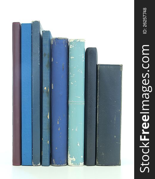 Stack of old books isolated on white background