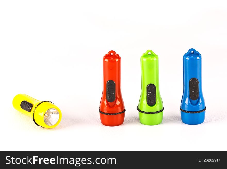 Four colourful plastic flashlight on white background. Four colourful plastic flashlight on white background.