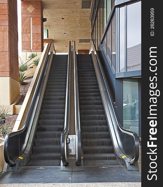 Outdoor escalators in motion with people