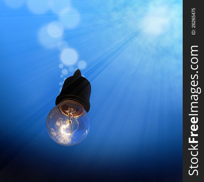 Light bulb underwater with bubble and shinning light