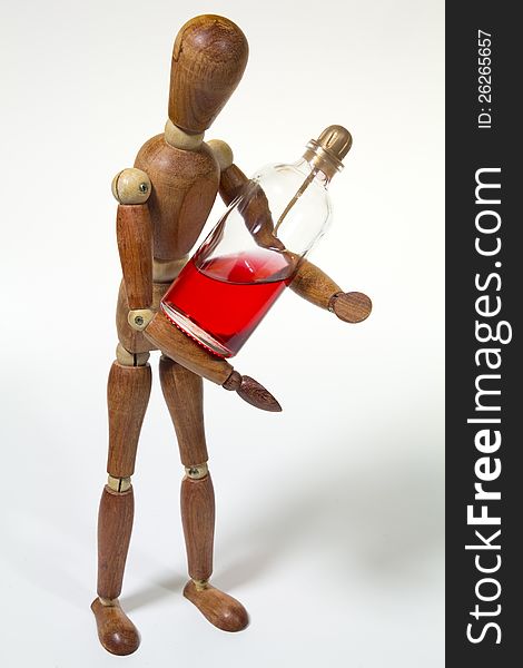 A wood doll with red parfum