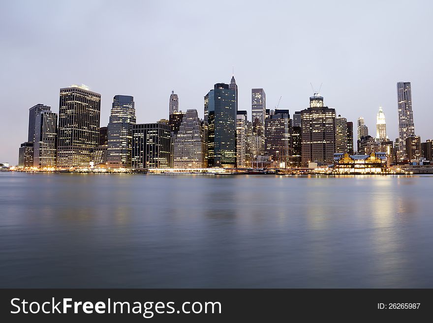 Manhattan skyline by night from Brooklyn bridge park - USA