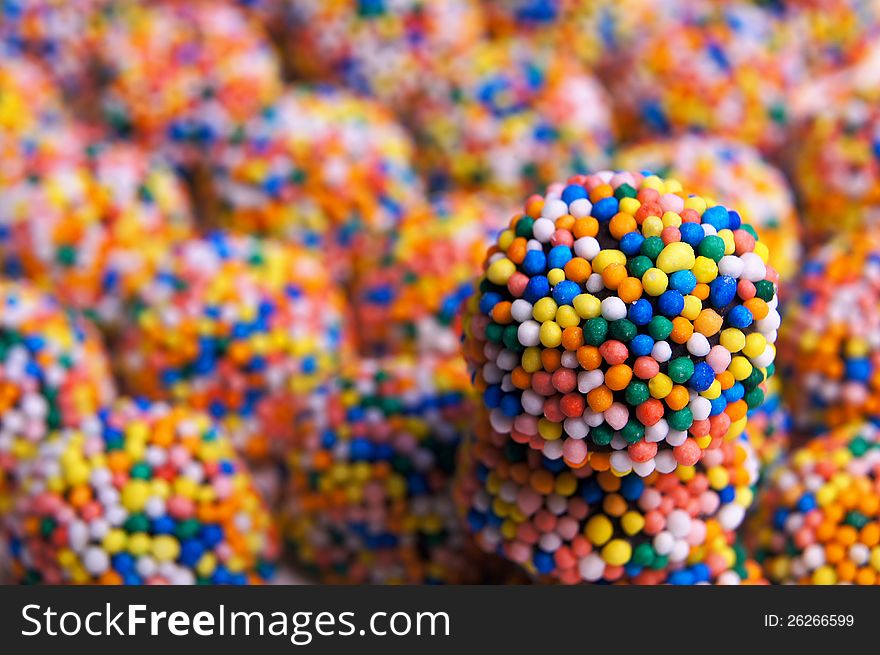 Close up of a candy coated licorice sweet stacked on top of others. Close up of a candy coated licorice sweet stacked on top of others.