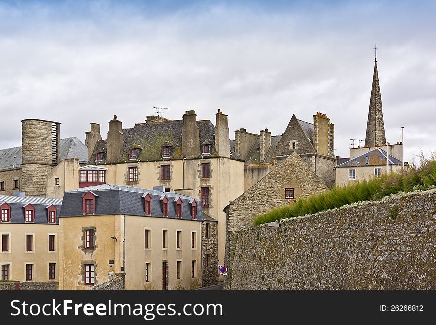 Townhouse and defensive walls in Saint-Malo. Saint-Malo is a walled port city in Brittany (prefecture Ille-et-Vilaine) in northwestern France on English Channel.