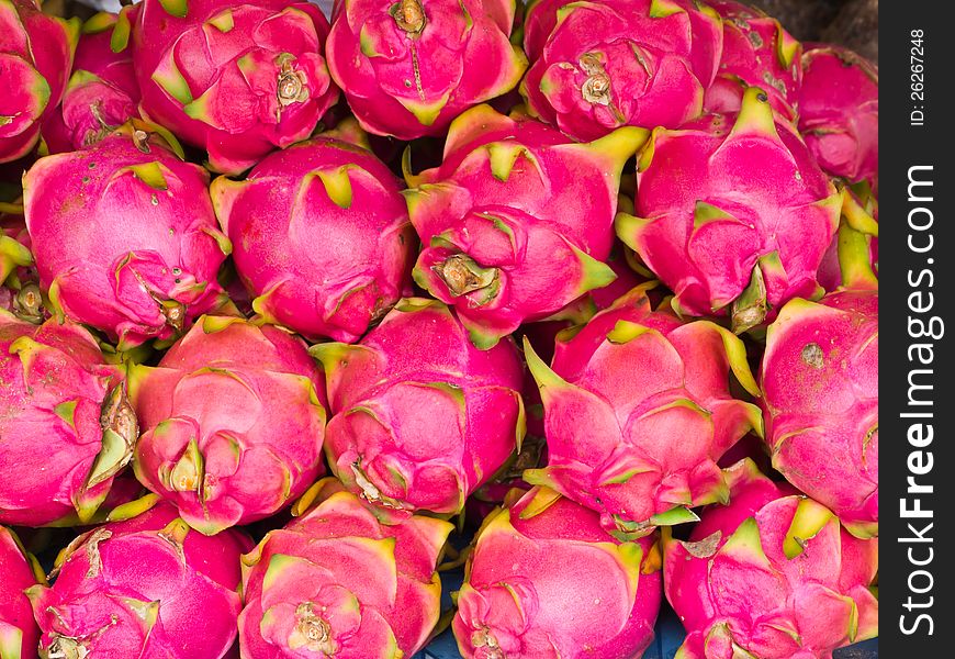 Red dragon fruits in market