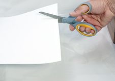 Cutting Paper With A Pair Of Scissors Stock Photos