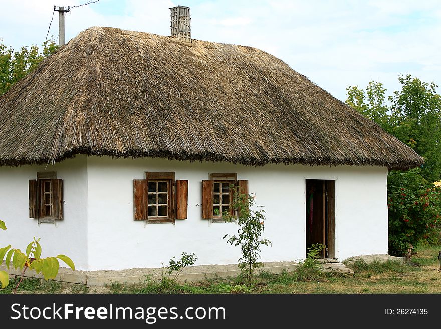 Ukrainian village house with a thatched roof