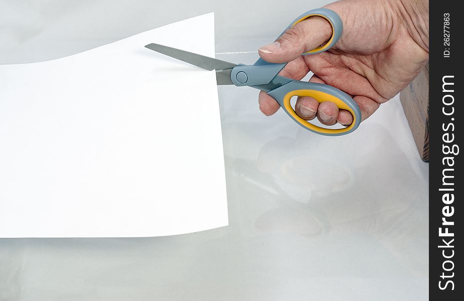 Cutting Paper With A Pair Of Scissors