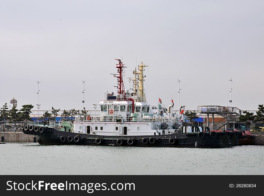 Tugboats parked on the pier which taken in china