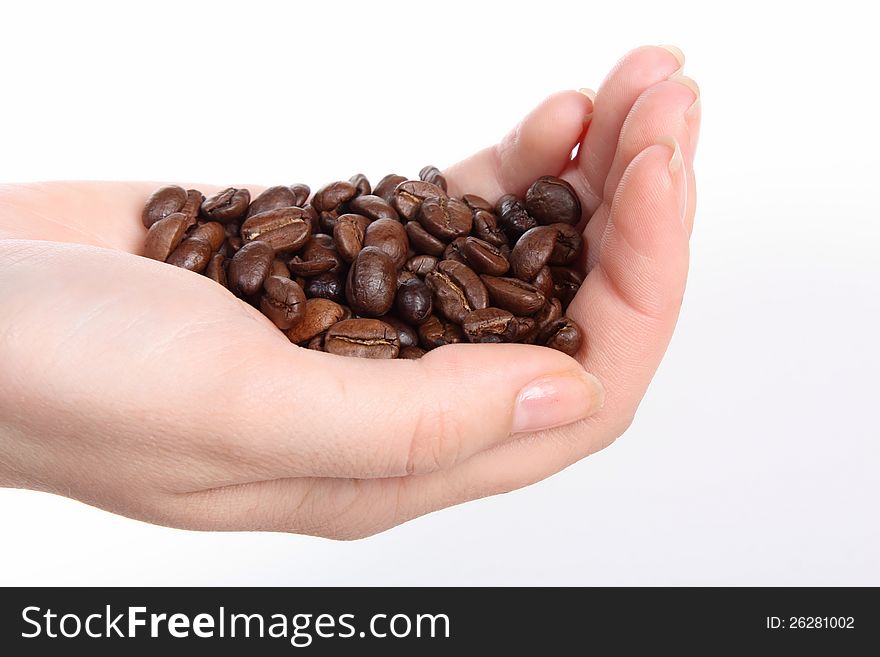 Hand full of coffeebeans, isolated. Hand full of coffeebeans, isolated