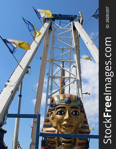 Amusement ride with the head of pharaoh inticing riders at the local county fair.