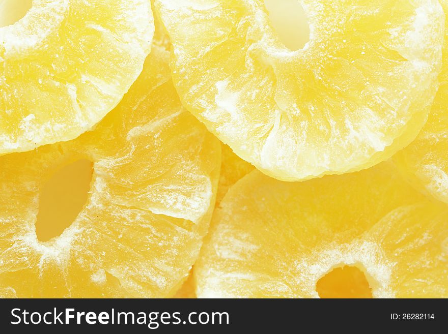 Closeup of many dried pineapple fruits as background