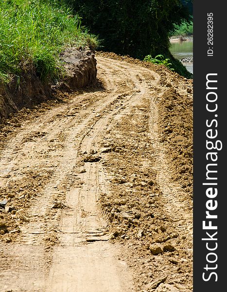 The road has been damaged by flooding. The road has been damaged by flooding.