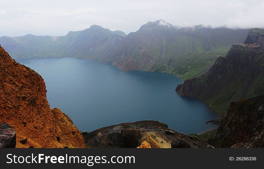 This is a photo of tianchi in Changbai mountain in Chinaã€‚. This is a photo of tianchi in Changbai mountain in Chinaã€‚